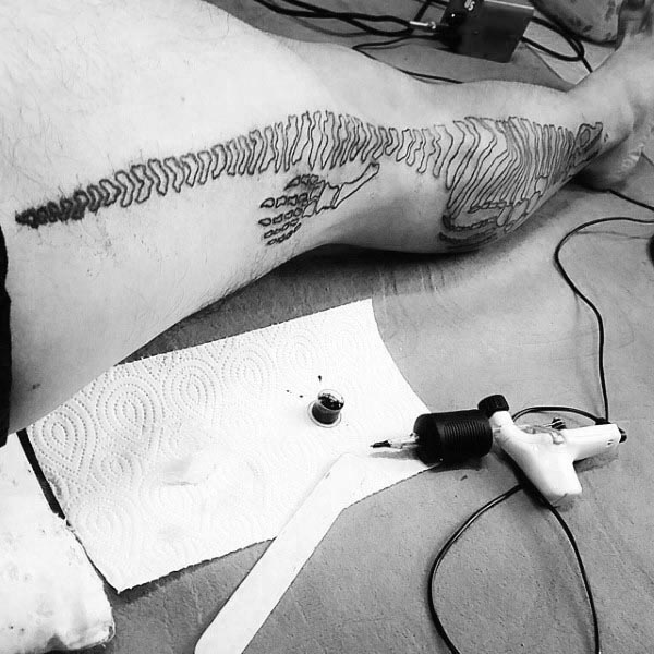 Cool Dinosaur Bones Mens Leg Tattoo
