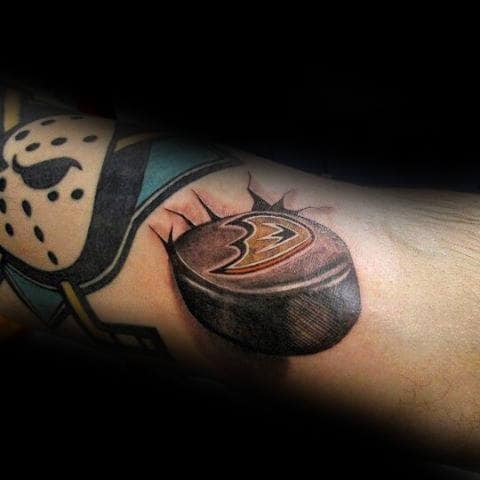 Cool Ducks With Hockey Puck Mens Forearm Tattoo Design Ideas