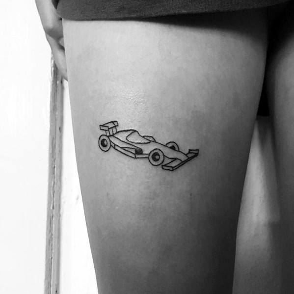 Minimalist Ferrari F1 tattoo featuring a sleek, outlined race car design on the thigh, symbolizing speed, precision, and racing passion.