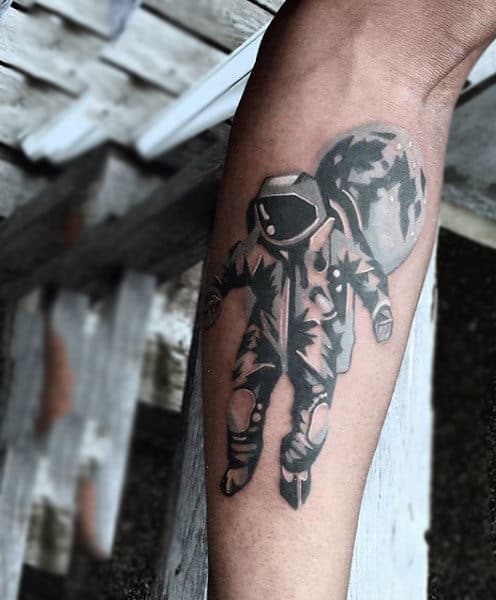 Cool Floating Astronaut Tattoo On Forearms