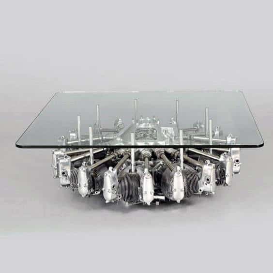 Glass coffee table with a base made from an airplane engine