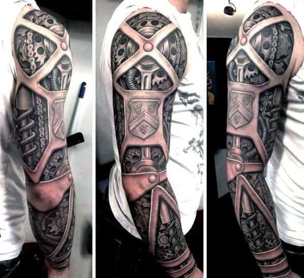 Detailed biomechanical full-sleeve tattoo on a person's arm featuring gears and circuits