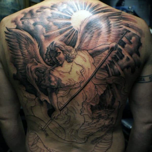 Full-back tattoo of an angel with a spear and wings, under a radiant sun