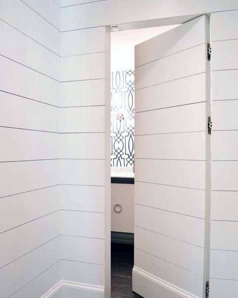 white shiplap wall secret door