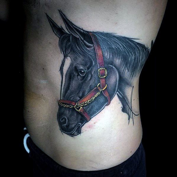 Realistic horse head tattoo on the ribcage, featuring a red halter with gold chain detail and soft black shading
