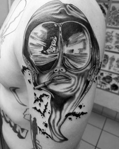 Black and white Hunter S. Thompson tattoo featuring distorted aviator glasses reflecting a road scene, with a surreal melting effect and a cigarette.