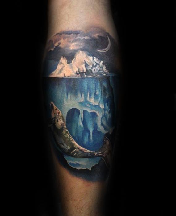 Colorful iceberg tattoo with moonlit sky and a detailed shark swimming beneath the surface, capturing the ocean's hidden depths.
