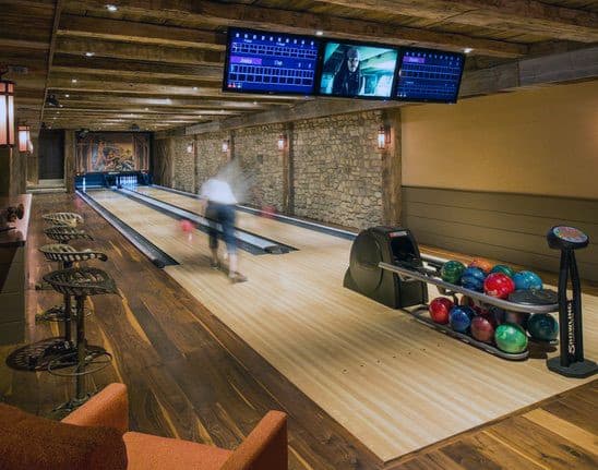 basement bowling alley stone walls wood floors 