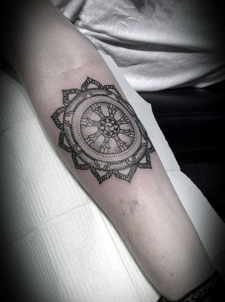 Cool Inner Forearm Dharma Wheel Tattoo Ideas For Males