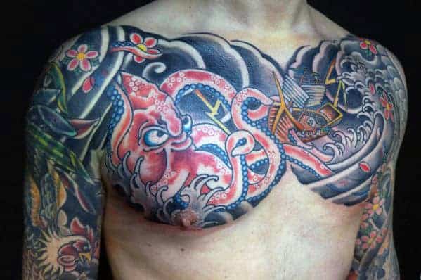 Dynamic chest tattoo featuring a vibrant red octopus, stormy seas, and a ship battling the waves in Japanese style