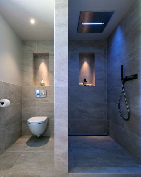 Contemporary bathroom with cool LED lighting, recessed niches, and sleek shower design, creating a modern, minimalist vibe