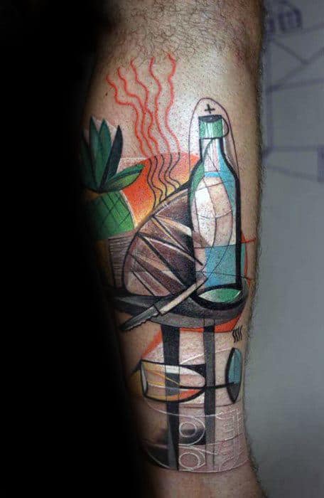 Cubist tattoo on the leg featuring a bottle, bread, and leaves in abstract geometric shapes with earthy tones and fine line accents.