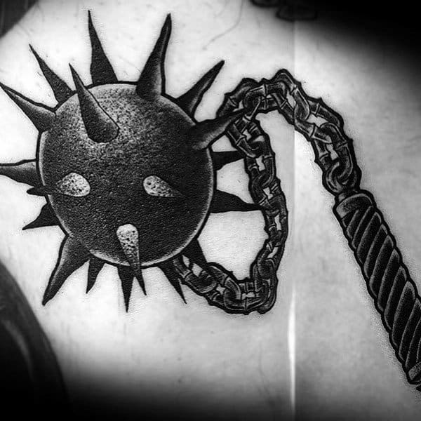 Black and gray mace tattoo with a spiked ball and chain, featuring intricate shading and a textured grip, symbolizing power and resilience.