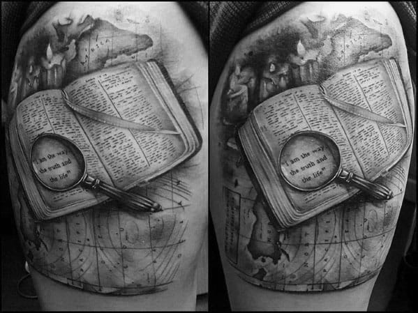 Tattoo of an open book with a magnifying glass highlighting a quote, set against a vintage world map for a detailed, realistic design.
