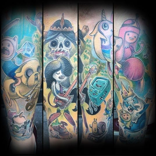 Adventure Time full sleeve tattoo with vibrant characters including Finn, Jake, Marceline, Princess Bubblegum, BMO, Ice King, and Lady Rainicorn.