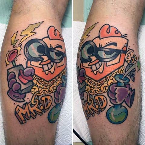 Colorful and bold tattoo of Dexter from Dexter’s Laboratory styled as a hip-hop character with gold chains, shades, and a potion flask.