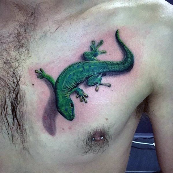 Realistic green gecko tattoo on chest with 3D shading and detailed texture, giving the illusion of the lizard crawling on skin.
