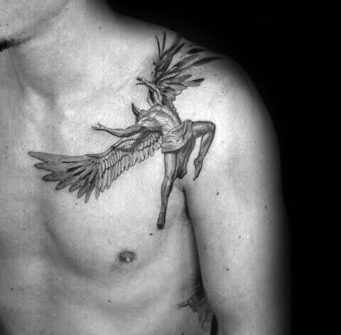 Detailed tattoo of a falling angel with large wings and dynamic posture, inked across the chest and shoulder.