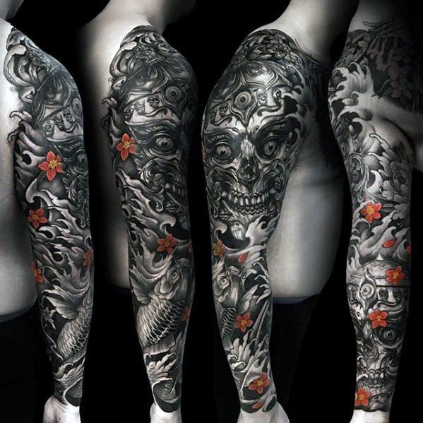 Black and grey Tibetan skull sleeve tattoo with intense shading, koi fish, and vivid red-orange flowers for contrast.