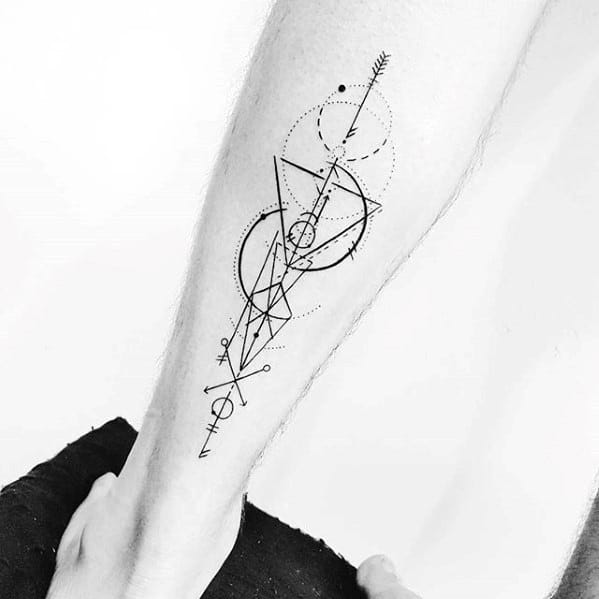 Geometric arrow tattoo on the forearm with layered triangles, circles, fine lines, and symbolic shapes in an abstract modern style.