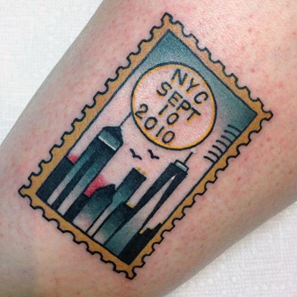 Tattoo of a postage stamp featuring NYC skyline silhouettes with a postmark dated Sept 10, 2010, in bold and colorful style.