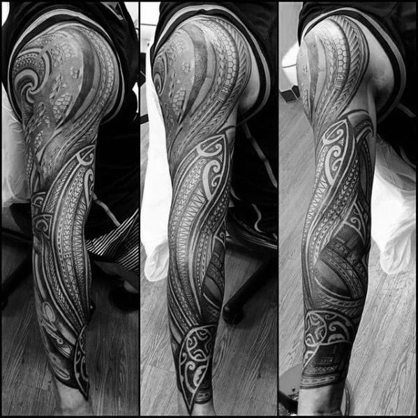 Full sleeve Polynesian tattoo featuring intricate tribal patterns and oceanic motifs symbolizing heritage, strength, and protection.