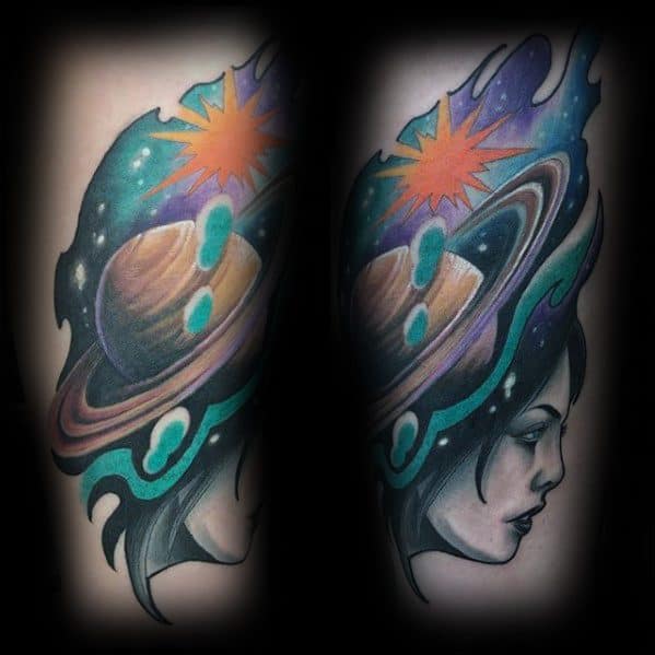 Colorful Saturn tattoo design for men featuring a woman’s face, cosmic flames, and a glowing planet with rings and stars.