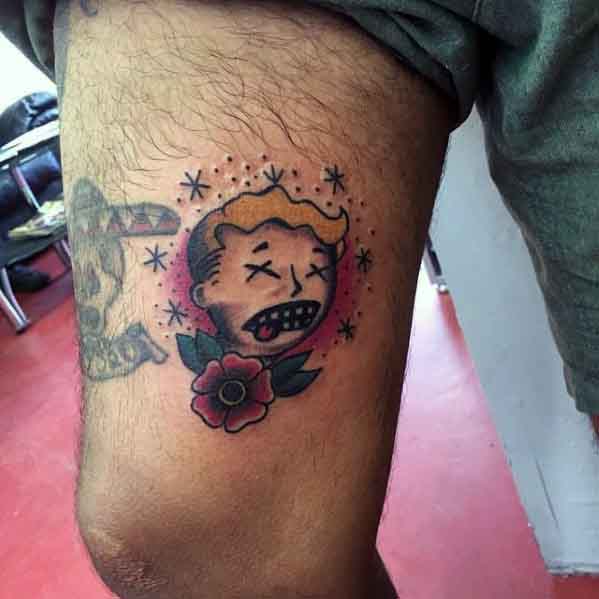 Vault Boy tattoo with a distressed expression, surrounded by stars and a red rose, done in a traditional old-school style.