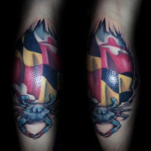 Maryland flag tattoo on the forearm with a torn skin effect, featuring a detailed blue crab at the bottom, symbolizing Maryland pride.