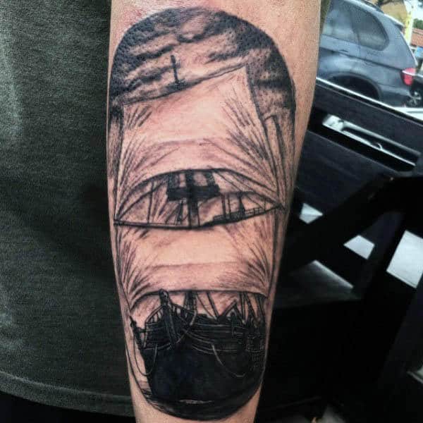 Cool Mens Arm Sailing Ship Tattoo In Black Ink