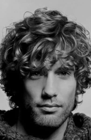 Man with medium-length, curly hair