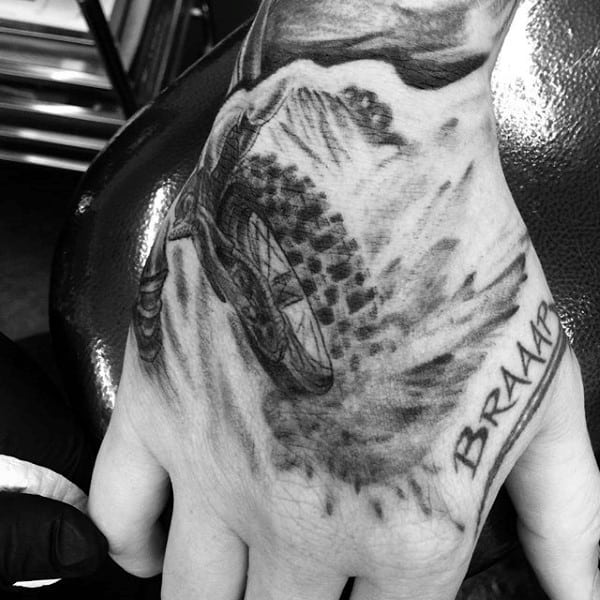 Cool Mens Hand Tattoo Of Motocross Dirt Bike Tire