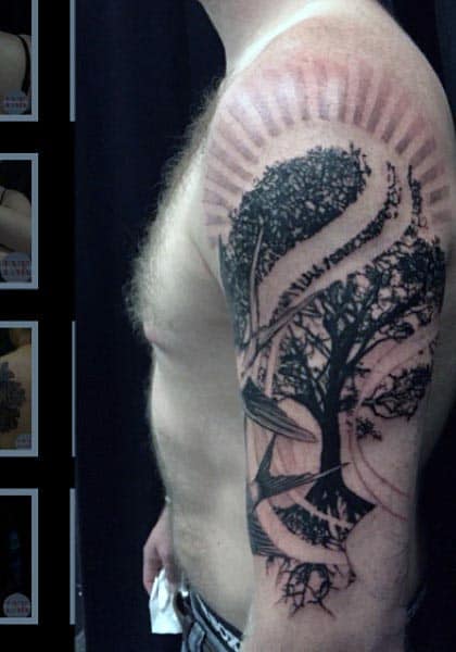 Black and grey tattoo of a tree with swirling wind patterns, dynamic shading, and radiating lines on the upper arm