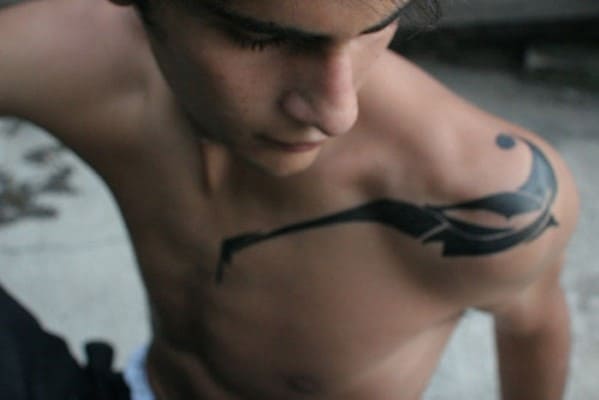 Black shoulder tattoo