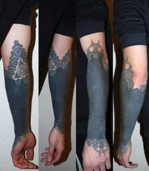 Cool Mens Wrist And Forearm Blackwork Tattoo With Pattern At Top And Bottom Of Design