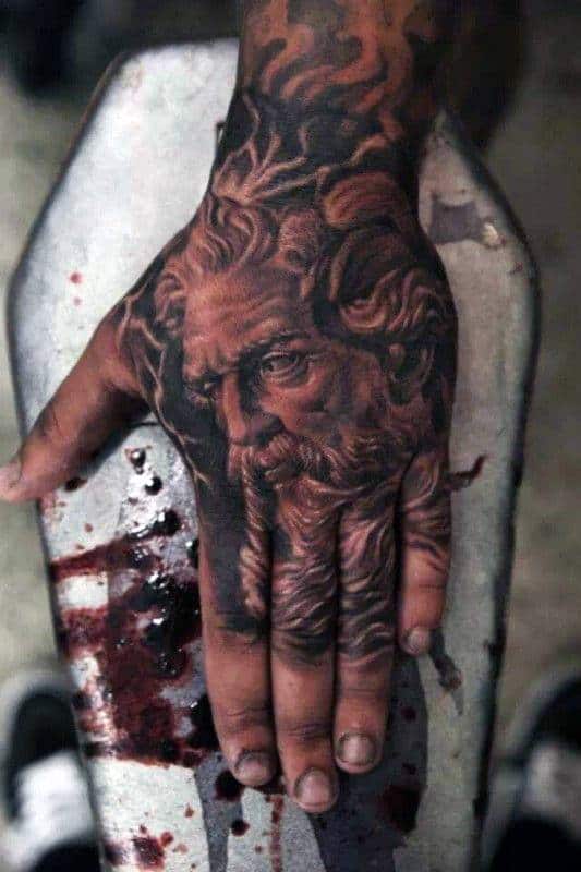 Hand tattooed with a detailed image of an elder's face