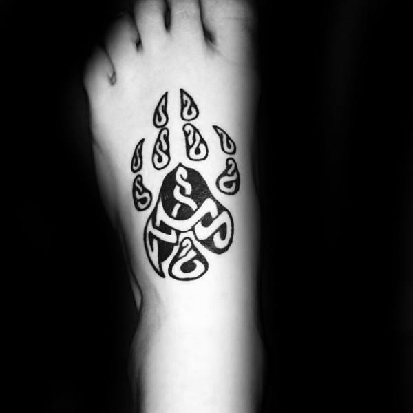 Cool Negative Space Wolf Paw Foot Tattoo On Gentleman
