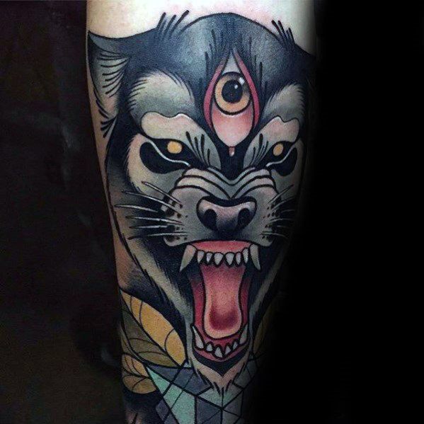 Neo-traditional tattoo of a snarling wolf with a third eye, bold black shading, fierce golden eyes, and geometric patterns for a mystical look.