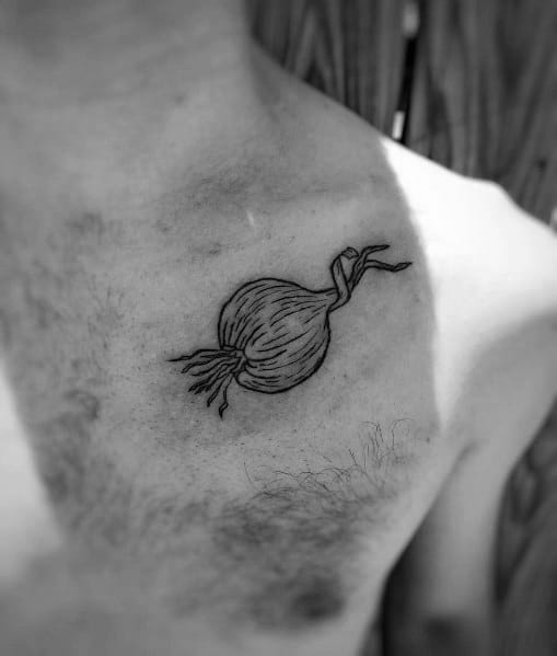 Black ink onion tattoo on the upper chest with fine line details, featuring sprouting leaves and roots for a minimalist yet artistic design.