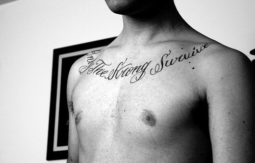 Cool Only The Strong Survive Male Chest Tattoos