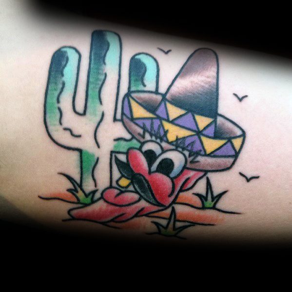 Cartoon-style chili pepper tattoo wearing a sombrero with a mustache, set against a cactus and desert background for a fun, lively design.
