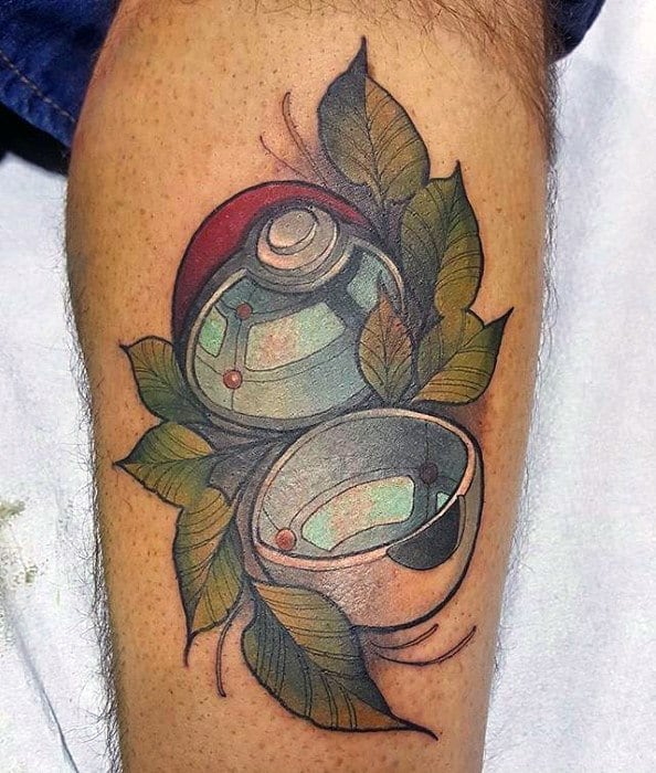 Open Pokeball tattoo with leafy details and earthy tones, blending nature elements with a modern illustrative style.