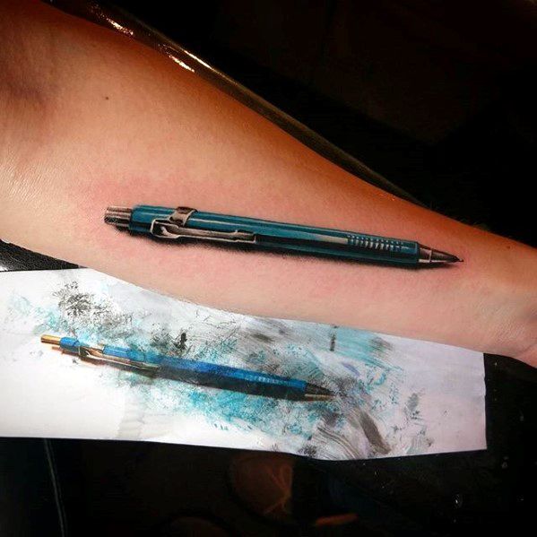 A 3D pen tattoo adorns the forearm, resting beside a smudged ink sketch of the same pen and a pencil, seamlessly blending art forms