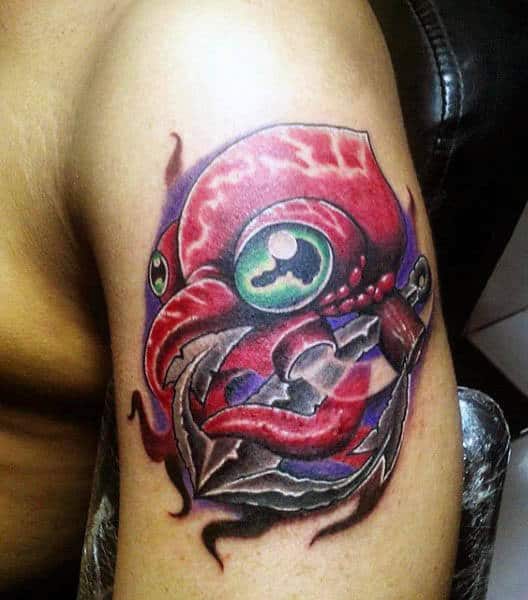 Cool Red Squid Tattoo With Green Eyes And Anchor On Mans Upper Arm