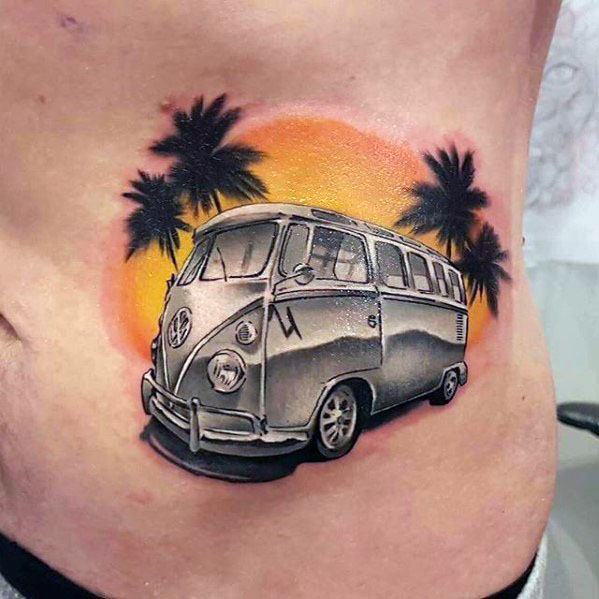 Volkswagen van tattoo with palm trees and a vibrant sunset background on the side torso, combining realism and color.