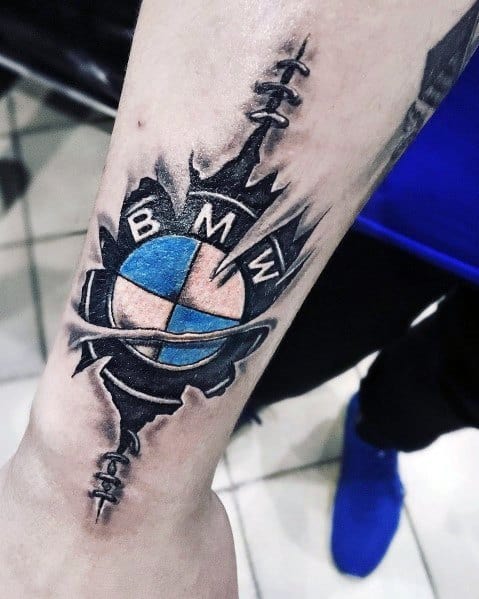 3D BMW logo tattoo on forearm, featuring a torn skin effect for a bold and striking automotive-inspired design.