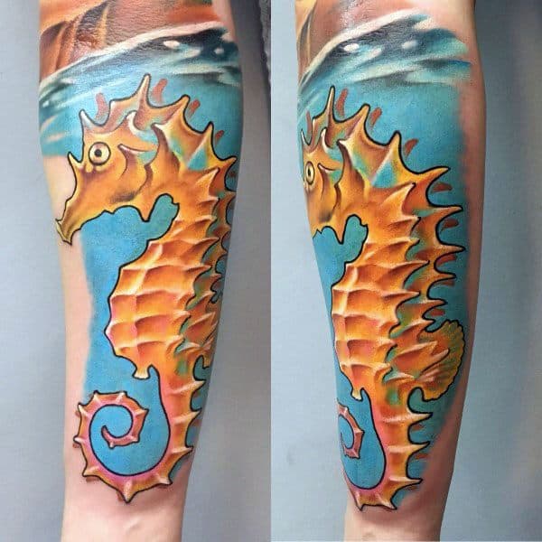 Vibrant seahorse tattoo on forearm, featuring bold orange and yellow hues with a blue ocean background for a dynamic, colorful design.
