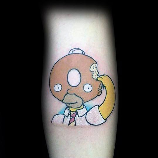 Creative tattoo of Homer Simpson with a donut-shaped head, taking a bite out of himself in a surreal and humorous design.