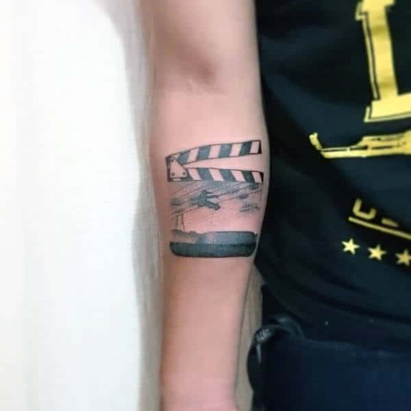 Cool Skateboard Movie Themed Tattoo Design On Mans Inner Forearm
