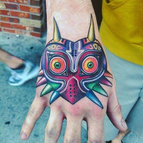 Cool The Legend Of Zelda Male Hand Majoras Mask Tattoo Designs